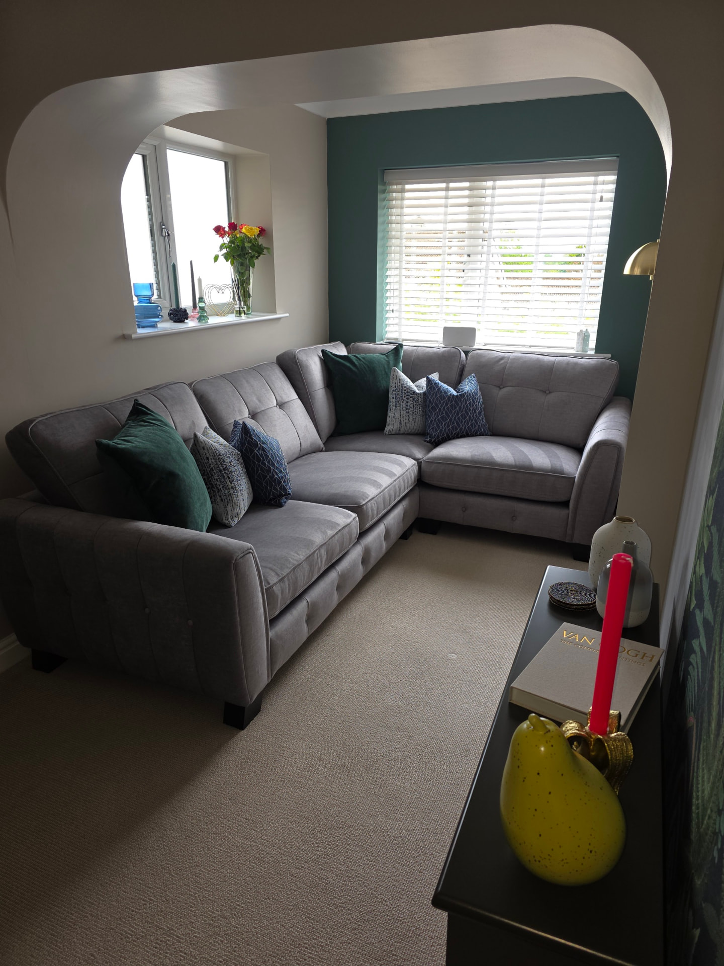 Freshly cleaned living room with plumped cushions and vacuumed carpet