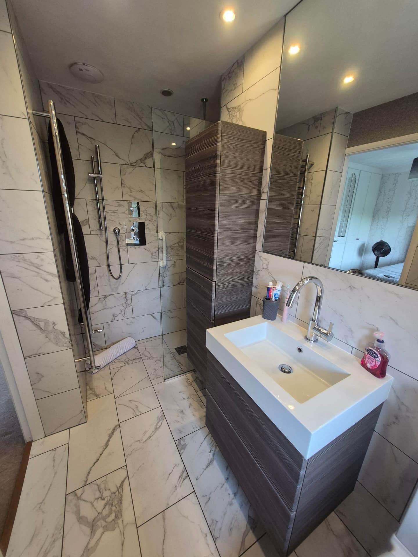 Marble shower room cleaned to a shine